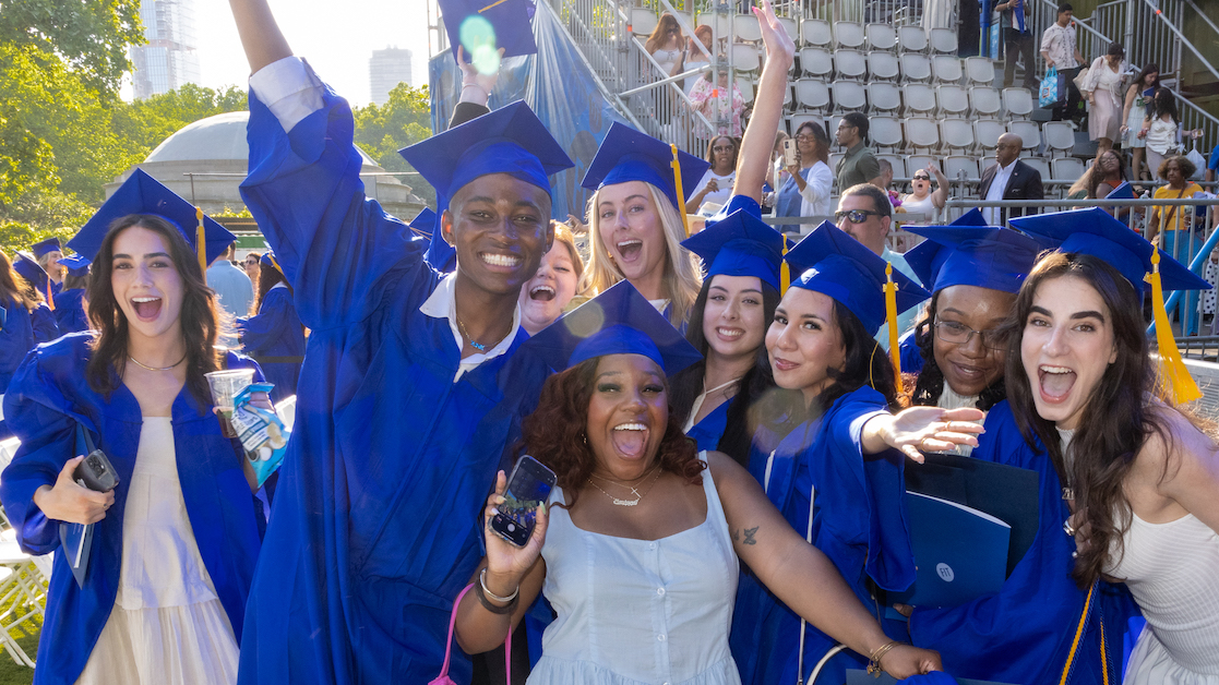 A group of FIT graduates celebrating together. 